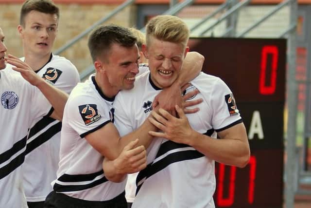 JJ O'Donnell (second from right) embraces Luke Armstrong (far right) following a goal for Gateshead against Leyton Orient in the National League (photo: Gateshead FC).