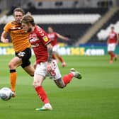 Hayden Coulson of Middlesbrough battles for possession with Matthew Pennington of Hull City.