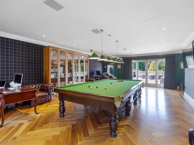 Located on the first floor of this home is a large games room.