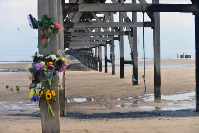 Flowers and cards left in memory of Matthew Sherrington at Steetley Pier.