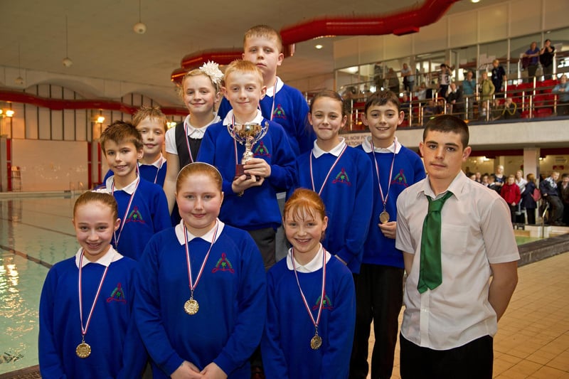 Pupils, in blue, at a swimming gala in 2011.