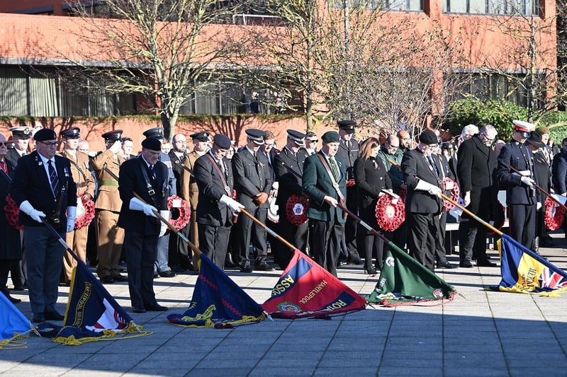 Standards are lowered during the Remembrance Day service.