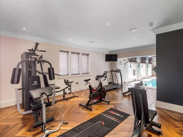This gym looks right out across the indoor pool.