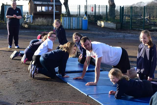 GB pole vaulter Charlie Myers putting Class 4 pupils at Greatham CofE Primary School, through their paces to help raise money for sports equipment.