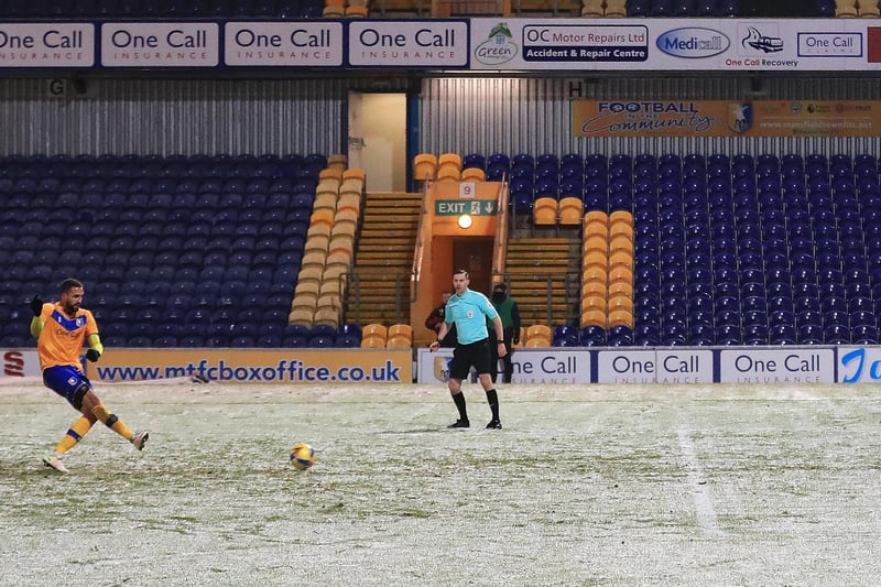 Jordan Bowery nets a penalty in the snow against Port Vale.