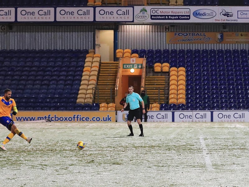 Jordan Bowery nets a penalty in the snow against Port Vale.