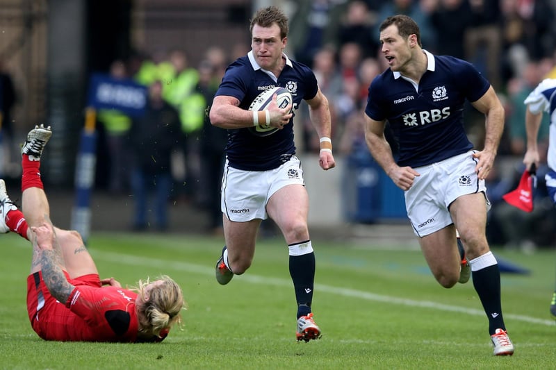 Stuart Hogg breaks away to score the opening try during the RBS Six Nations match between Scotland and Wales at Murrayfield Stadium on February 15, 2015, in Edinburgh.  (Photo by David Rogers/Getty Images)