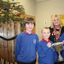 Hartlepool Rotary President Jane Tilly presents the trophy to Throston Primary School pupils Harry Fletcher (left), head noy Lucas Murphy and head girl Lilly Ward.
