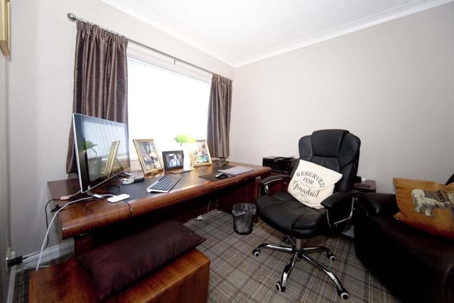 The forth bedroom of the home has been transformed into a home office.