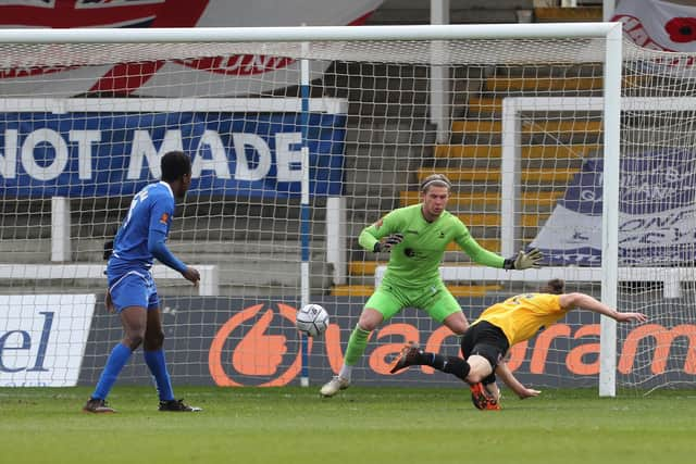 Matt Robinson of Dagenham heads past Ben Killip to level the score at 1-1  during the Vanarama National League match between Hartlepool United and Dagenham and Redbridge at Victoria Park, Hartlepool on Friday 2nd April 2021. (Credit: Mark Fletcher | MI News)