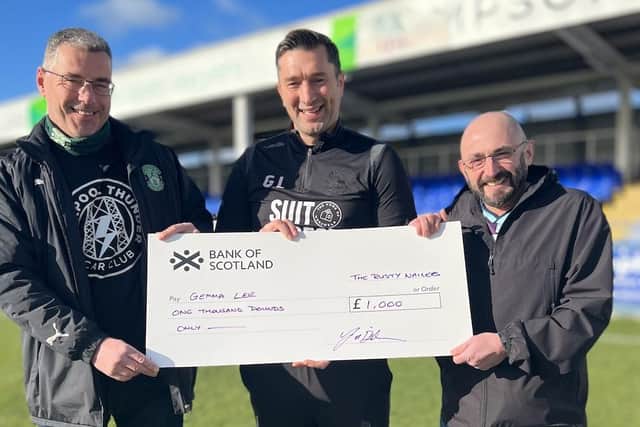 Marcus Chalmers and Jeff Dickson presented Graeme Lee with a £1000 cheque yesterday for the Gemma Lee fund. Picture courtesy of Hartlepool United.