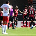 Philip Billing of AFC Bournemouth celebrates with Dominic Solanke and team-mates after scoring his side's first goal against Middlesbrough.