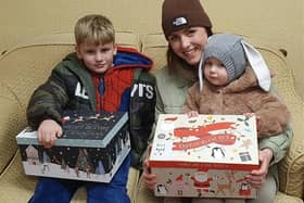 Mum Amanda Marshall with children Marshall (left) and Felicity with their boxes for Meynell & Mason Funeral Directors' Operation Christmas Child appeal.