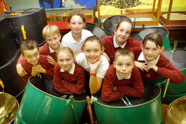 The school's steel band members strike a pose before a performance in 2005.