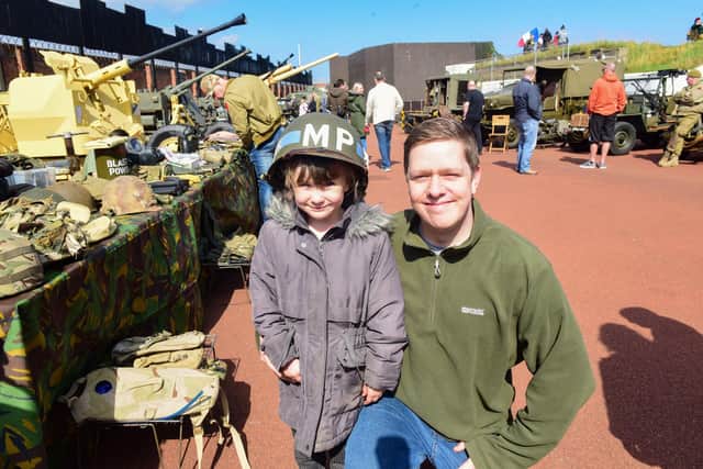 Alex Price with daughter Elizabeth, aged five, of Stockton, trying on a World War 2 American Military Police helmet at the Heugh Battery Museum's Military Vehicle Display on Saturday.