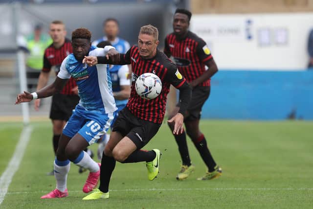 Barrow's Offrande Zanzala in action with Hartlepool United's Gary Liddle  during the Sky Bet League 2 match between Barrow and Hartlepool United at Holker Street, Barrow-in-Furness on Saturday 14th August 2021. (Credit: Mark Fletcher | MI News)