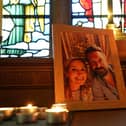 Candles are lit around a photo of Nicola Bulley (left) and her partner Paul Ansell on an altar at St Michael's Church in St Michael's on Wyre, Lancashire, as police continue their search for the missing mother of two.