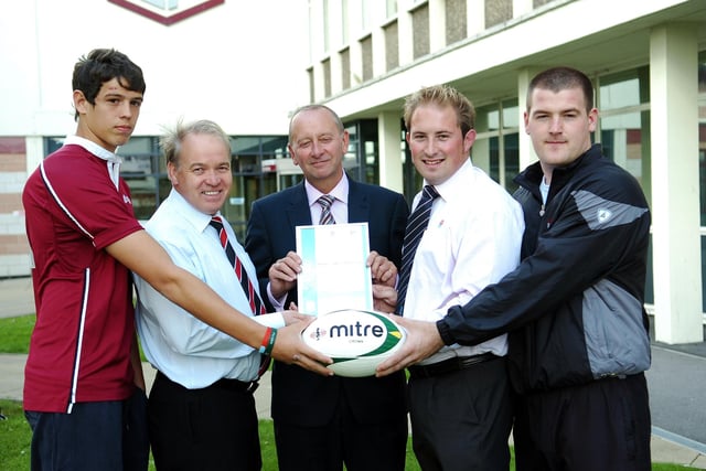Michael Bretherick (centre) Principal of  Hartlepool College of FE is presented with a framed certicicate by RFU members Alec Porter and Chris Simpson, with student Anthony Rumis and college lecturer, Steven Clayton.