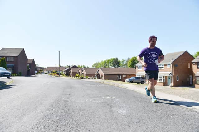 Sean Ivey running around his street in Wingate as he nears the end of his Alice House 180-mile fundraising run. Picture by FRANK REID