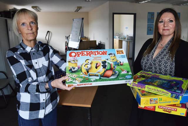 Denise Bell (left) support worker and Rachael Oliver general manager of Pathways To Independence with games. Picture by FRANK REID