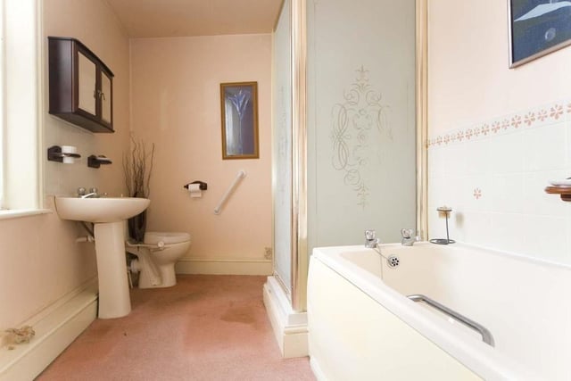 The family bathroom features a shower enclosure and a bath.