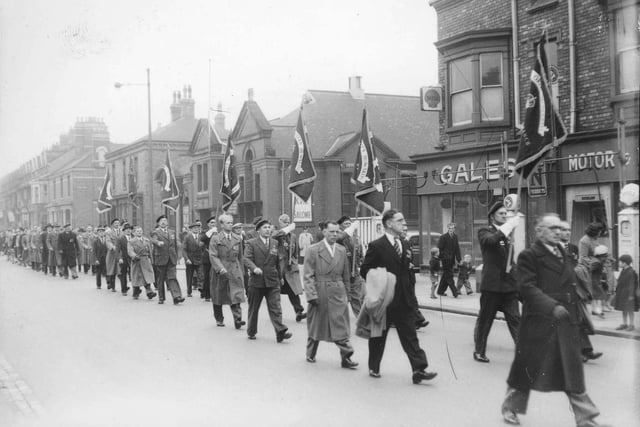 A parade makes its way along York Road passing the library, Northern cinema and Gales Garage on York Road in the 1950s.