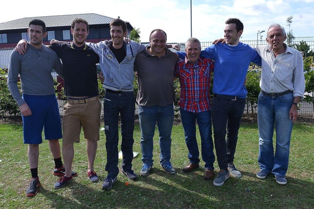 All smiles from the dads and grandads before they compete in the Cheeky Monkeys sports day in 2015.
