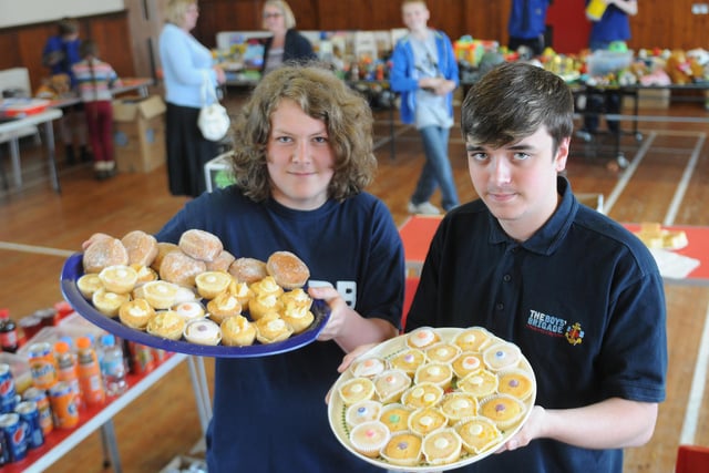 Boys Brigade members, Stuart Matthews and Jack Hanlon, show off just some of the cakes that were on sale during their fundraising event at St Matthews Hall in 2013.