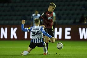 Will Goodwin of Hartlepool United and Ciaran Brennan of Sheffield Wednesday in action during the EFL Trophy match. (Credit: Will Matthews | MI News)