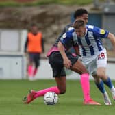 Matty Daly of Hartlepool United in action with Exeter City's Sam Nombe during the Sky Bet League 2 match between Hartlepool United and Exeter City at Victoria Park, Hartlepool on Saturday 25th September 2021. (Credit: Mark Fletcher | MI News)
