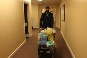 Hospital volunteer Kenny Tucker with some of the donations.