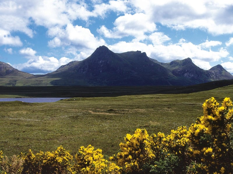 Known as the Queen of Scottish Mountains due to its distict profile, Ben Loyal rises above the Kyle of Tongue on the north coast of Scotland. The long ridge takes in three peaks and offers views of moor, mountains and sea.