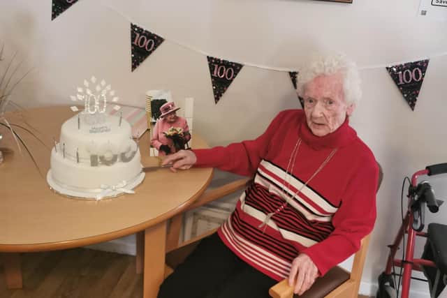 Rose Caffrey with her 100th birthday cake and card from the Queen at Charlotte Grange care home in Hartlepool.