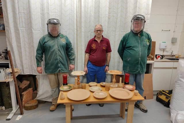 Centre, Dennis Wake, Founder of Woodturning Hartlepool, with two students.
