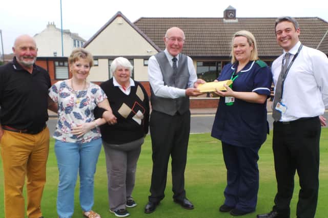 Seaton Carew Golf Club fundraisers Peter Hamilton, Jackie Hamilton, Yvonne Fisher and Ian Phillips with Helen Dicken and Richard Scott, from the North Tees and Hartlepool NHS Foundation Trust.