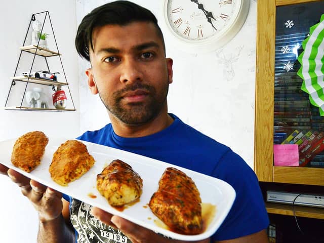 Duran Ramlochan with a tray of barbecue chicken and Peri Peri chicken.