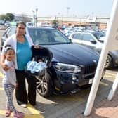 Vanessa Mbawa with her children Melissa, seven, and baby Marcus, is calling for more child and parent parking at Anchor Retail Park after receiving a £60 penalty charge.