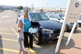 Vanessa Mbawa with her children Melissa, seven, and baby Marcus, is calling for more child and parent parking at Anchor Retail Park after receiving a £60 penalty charge.