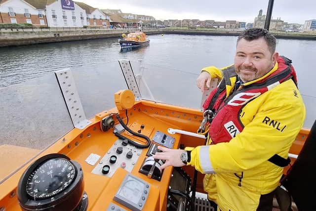 Robbie Maiden steers the lifeboat as coxswain. Picture: Tom Collins.