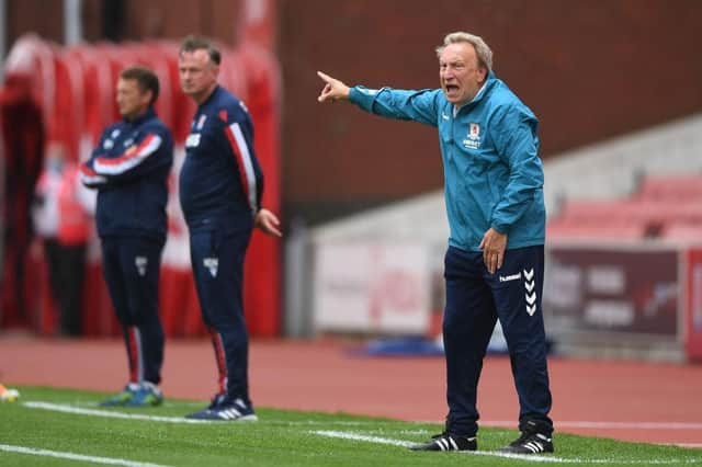 Neil Warnock made a winning start as Middlesbrough boss with a 2-0 win at Stoke.