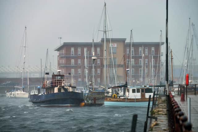 Small boats are hit by strong winds and rain in Hartlepool Marina.