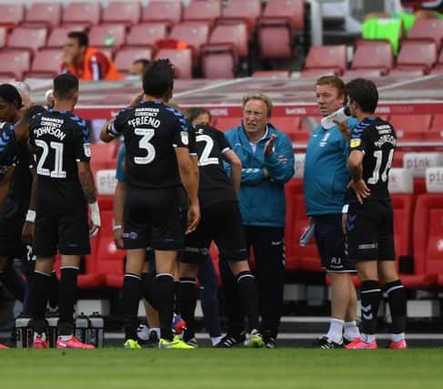 Neil Warnock speaks to his Middlesbrough players during a 2-0 win at Stoke.