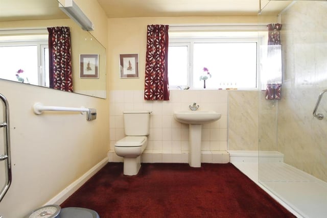The spacious bathroom boasts a newly fitted walk-in shower.