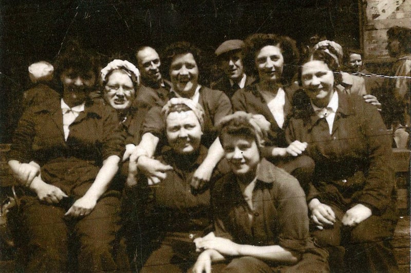 Women workers during World War Two at Brown Bayley's, Attercliffe. Pictured (top row on the right) is Lavinia Shaw (nee Cockayne). She was born in 1899 and worked in the machine shop on a lathe at Brown Bayley's during the 1940s along with her daughters Hilda (from 1941) Winifred (from 1942) and Lavinia (junior) (from 1948). Lavinia Shaw died in 1974. Ref no A03717
