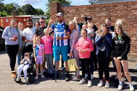 Gavin Jones is greeted by family and friends as he returns to Hartlepool after his two-week solo walk from Swansea.
