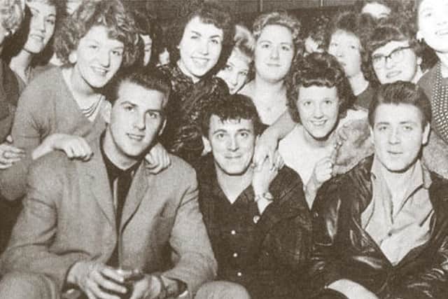 Eddie Cochran, right, meets fans on the UK tour with Gene Vincent, middle, and Vince Eager, who has written the book’s foreword
