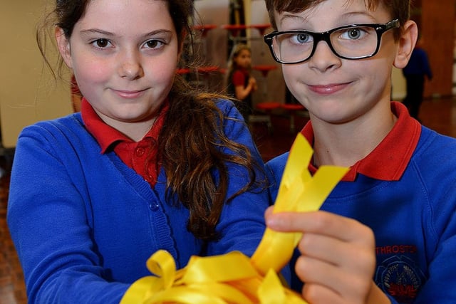 Throston Primary school council members hold yellow ribbons in 2015.