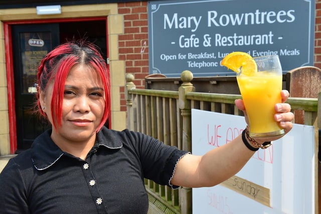 Marry Moran from Mary Rowntrees with a refreshing orange and ice drink. Picture and caption by FRANK REID.