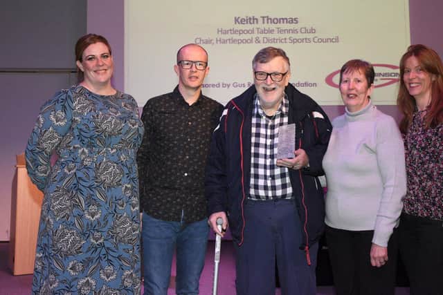 Keith Thomas was presented with the Lifetime Achievement Award and stands for a photo with his proud family.