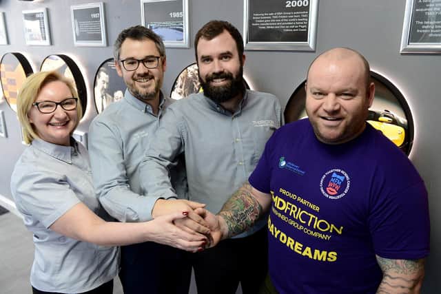 TMD Friction Staff (left to right) Alison Matthews, Tom Russell and Michael Findlay along with Michael Day from Miles for Men as they shake hands on a new partnership. Picture by FRANK REID